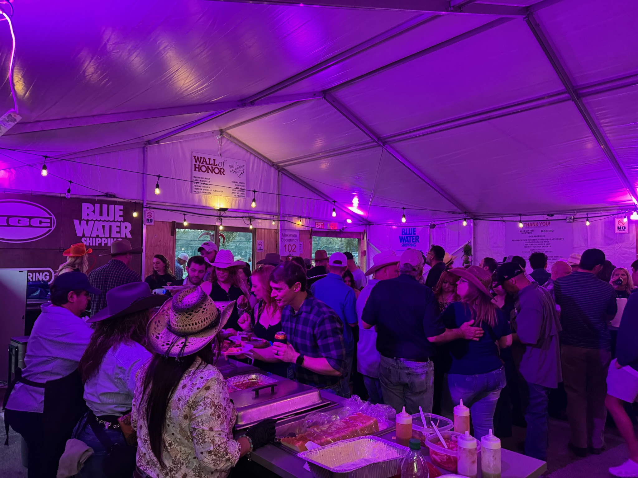 Guests gathering inside the Regroup BBQ tent